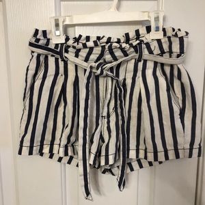 White and navy striped shorts with tie belt